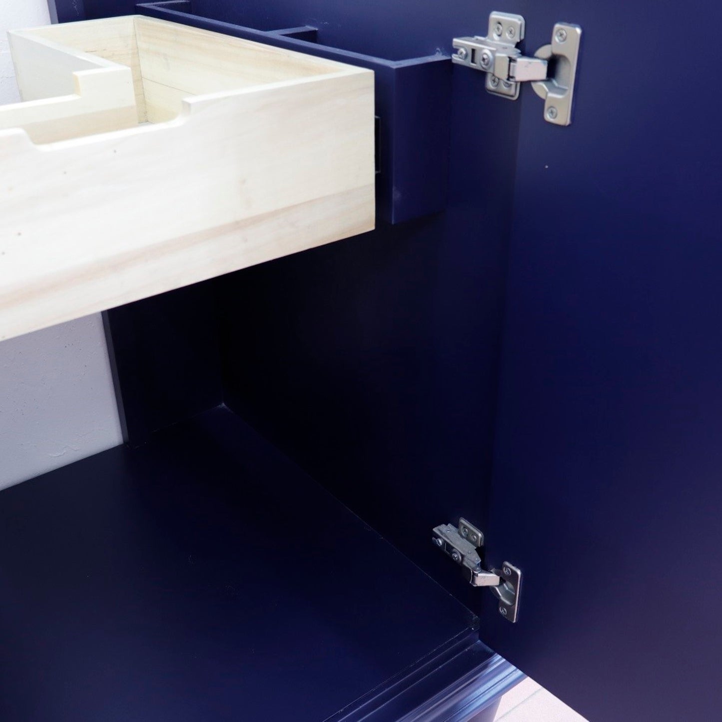 25" Single vanity in Blue finish with Gray granite and oval sink